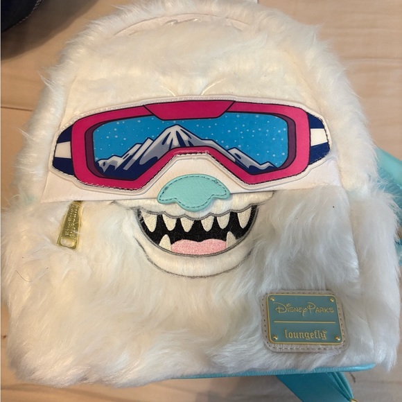 Loungefly Handbags - Loungefly White Furry Yeti Backpack with Pink and Blue Goggle Patch